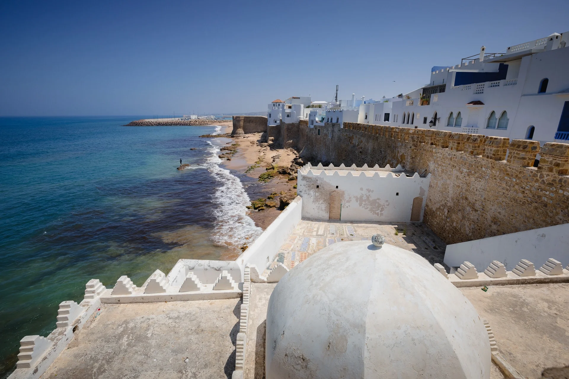 Asilah walls and a white dome above the sea