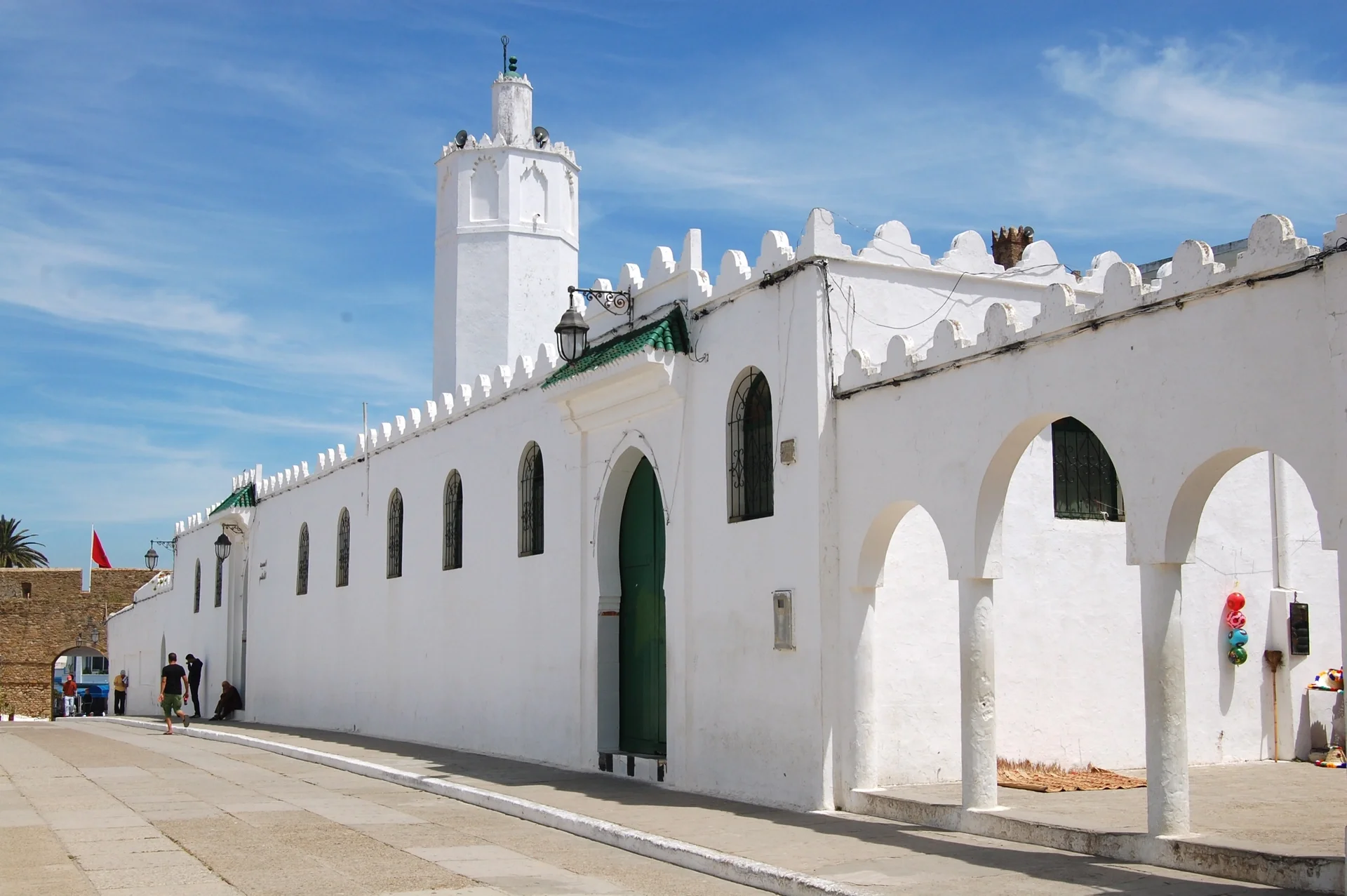 White facade and minaret of the Great Mosque of Asilah