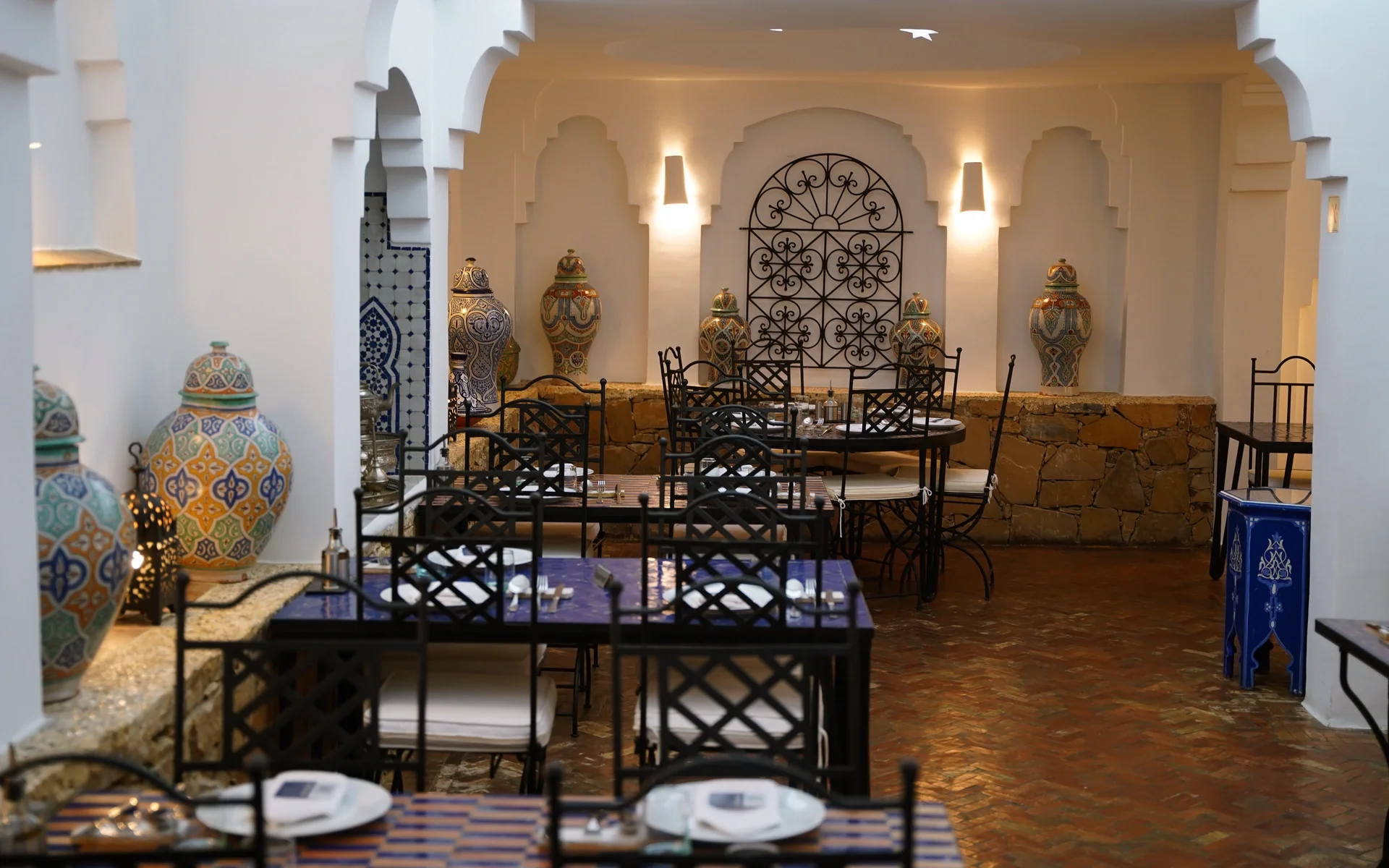 Dining room of Al Alba Restaurant with ceramic jars and arches